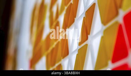 Puzzle made of colored glass with triangular shapes Stock Photo