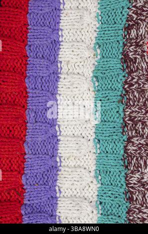 Knitted multicoloured texture. Background knitted stripes close-up Stock Photo