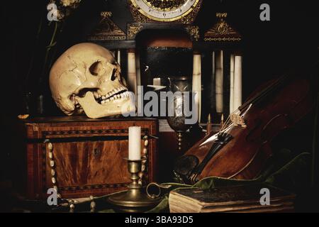Close-up still life, Dutch painting of the 17th century. On the table on a black background are flowers, a skull, a clock, a violin, keys. Things that Stock Photo