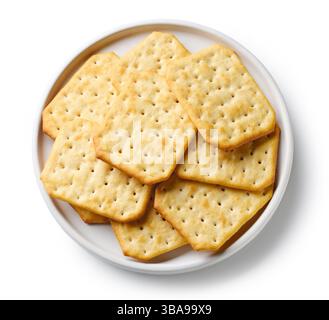 plate of crackers isolated on white background, top view Stock Photo