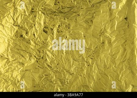 Texture of crumpled gold foil paper Stock Photo
