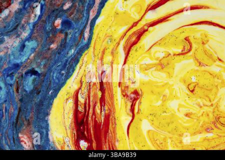 Bright blue acrylic stain with bright yellow. Marble coloured texture. A semicircle smeared with colours that looks like a celestial cloak. Abstract p Stock Photo