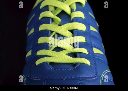 Texture of a blue trainers close-up part of the leather sports shoes Stock Photo