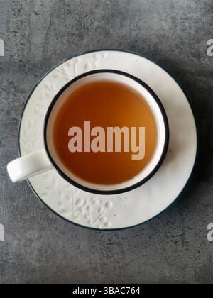 top view, White ceramic tea cup on a table Stock Photo