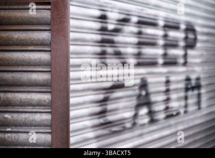 Urban Scene With 'Keep Calm' Written In Spray Paint On Some Shutters, With Shallow Depth Of Focus Stock Photo
