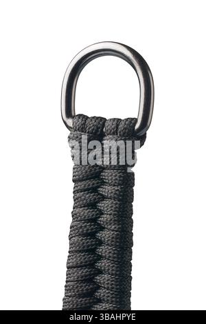 close-up of tightly woven black rope or cord attached to silver metal ring isolated white background, strong and durable material in camping or hiking Stock Photo