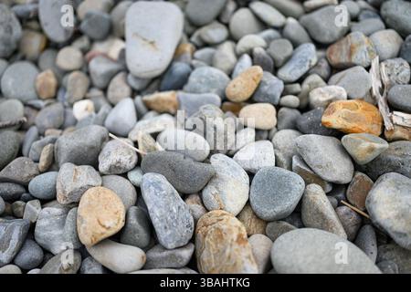 Cobbles on a shingle beach close up Stock Photo