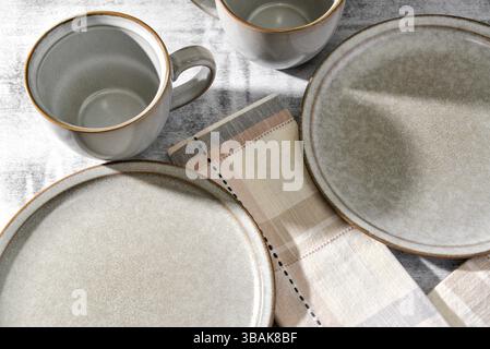 Empty plates and coffee cups on table Stock Photo