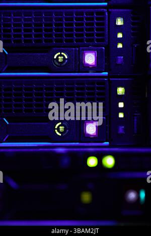 Illuminated Data Server Racks in Operating Data Center Stock Photo