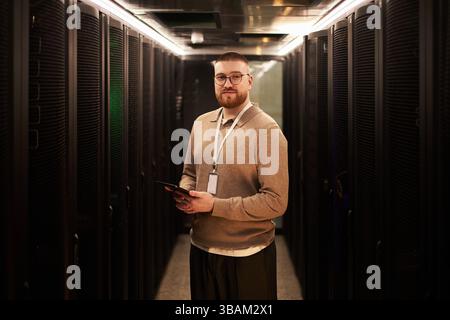 Portrait of Bearded Man Working in Data Center Server Room Stock Photo