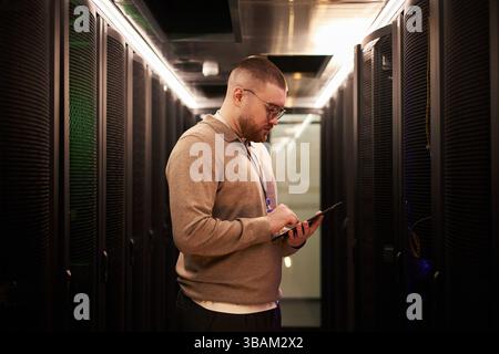 Man Wearing Glasses Working in Data Center Stock Photo