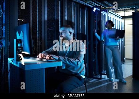 Managing Server Room Operations with Advanced Equipment Stock Photo