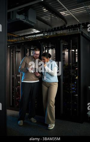Discussing Server Maintenance in Data Center Environment Stock Photo