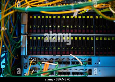 Multicolored Network Cables Connected to Server Rack Stock Photo