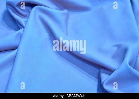 Surface natural piece of leather in blue color. Textured background Stock Photo