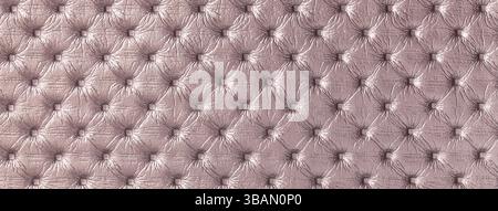 Texture of light brown leather background with capitone pattern, macro. Purple textile of retro Chesterfield style. Vintage fabric backdrop. Stock Photo
