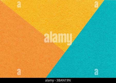 Texture craft yellow orange and blue paper background, macro. Vintage abstract cardboard with geometric shape and gradient. Felt backdrop closeup. Stock Photo