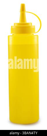 Yellow plastic dispenser bottle for mustard or other sauce isolated on white background. File contains clipping path. Stock Photo