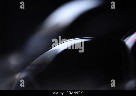 Bright silver reflection of liquid on black background, blue colours, surrealistic pattern, fantastic smooth movement, one line Stock Photo