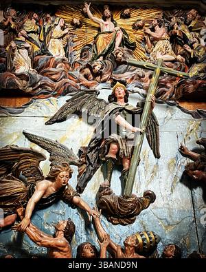 The winged archangel Saint Michael holding a sword and standing on the ...