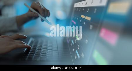 Project Management and Schedule Planning Displayed on a Digital Calendar Interface. Stock Photo