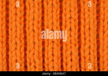 Bright orange wool knitted texture. Detailed  top view. Stock Photo