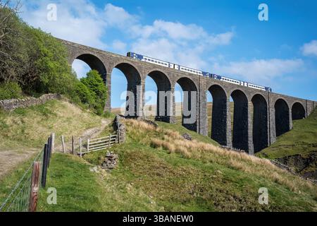 A Northern Sprinter train, from Leeds and Settle, crossing the Artengill viaduct in Dentdale, Westmorland & Furness, Cumbria, UK Stock Photo