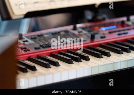Close-up of a modern red stage piano Stock Photo