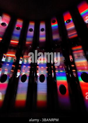 Colorful Abstract Light Installation with Rainbow Reflections in a Dark Exhibit Space at the Women's Pavillion, Expo 2025 Stock Photo