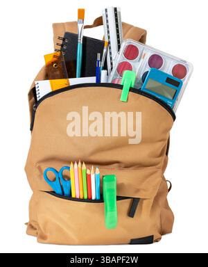 School backpack overflowing with Stationery Supplies isolated on white background, ready for back to school season Stock Photo