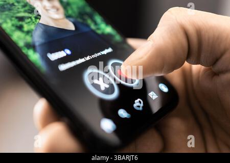 Date app. Gay man swipe and match. Romance scam. Dating site in phone. LGBT on social media. Like profile picture of a single guy. Online love. Stock Photo