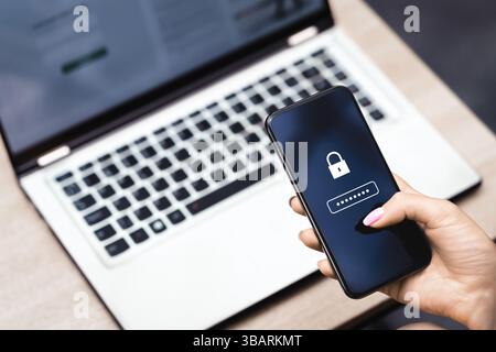 Password to protect data in phone. Cyber security against fraud and scam. Privacy lock online. Smartphone and laptop computer. Strong safety. Stock Photo