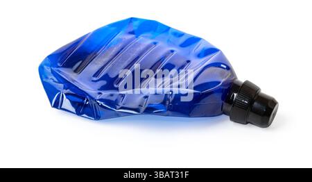 Empty and crumpled reusable water bottle laying on a white background Stock Photo