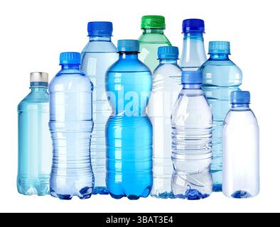 Various plastic water bottles are standing on a seamless white background, creating a composition Stock Photo