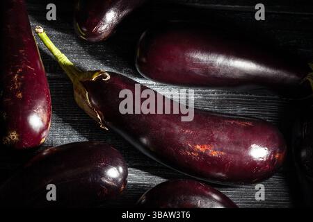 eggplant on black wood background Stock Photo