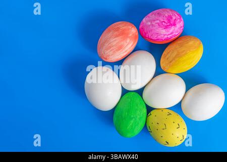 Easter eggs are creatively displayed on a blue background. Perfect for themes of celebration, spring, and cultural heritage. Stock Photo
