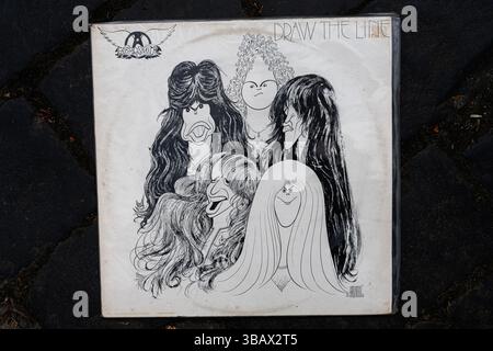 Lviv, Ukraine - May 13, 2025: Illustrated cover of Aerosmith 1977 album showcasing artistic caricature drawings. Stock Photo