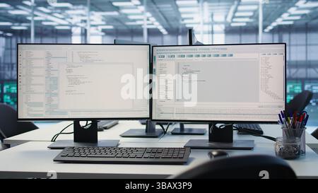 PC displays in data center providing computing resources for artificial intelligence processing massive datasets for training. Close up of code lines on computer in server room for machine learning Stock Photo