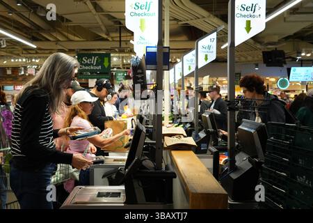 New York, USA.13th May 2025. Customers self-check out at a supermarket in Manhattan on May 13, 2025 in New York City. US consumer inflation rose 2.3 percent year-on-year in April, down from 2.4 percent in March and 2.8 percent in February, the US Labor Department reported on May 13. Credit: Liao Pan/China News Service/Alamy Live News Stock Photo