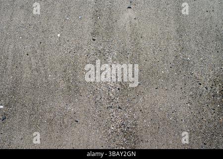 Wet beach sand close up for textures and patterns Stock Photo