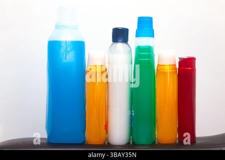 Multicolored plastic bottles with household chemicals. Stock Photo