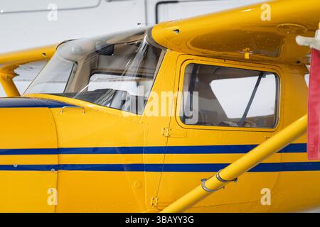 Yellow small plane airplane aeroplane, aircraft in hangar Stock Photo