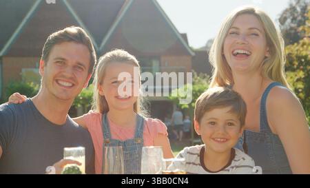 Portrait Of Family Enjoying Outdoor Summer Drink At Pub Stock Photo