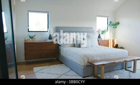 Interior Shot Of Stylish Modern Bedroom In Empty House Stock Photo