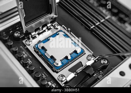 A central processing unit is securely seated in a motherboard socket Stock Photo
