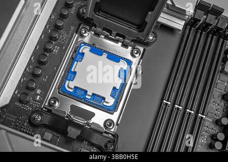 A central processing unit is securely seated in a motherboard socket Stock Photo