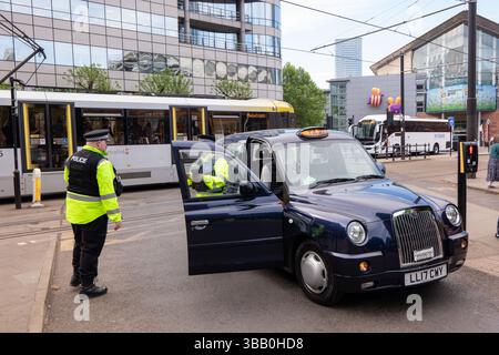 Manchester, UK. 14 May, 2025. Tram crash Manchester UK. A tram collided with a taxi on Lower Moseley street bringing the city centre to a halt. The Tram crash happened opposite the Biba 2025 Insurance conference where members of extinction rebellion were protesting at Manchester Central. Manchester. UK Picture credit garyroberts/worldwidefeatures.com Credit: GaryRobertsphotography/Alamy Live News Stock Photo