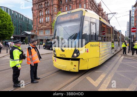 Manchester, UK. 14 May, 2025. Tram crash Manchester UK. A tram collided with a taxi on Lower Moseley street bringing the city centre to a halt. The Tram crash happened opposite the Biba 2025 Insurance conference where members of extinction rebellion were protesting at Manchester Central. Manchester. UK Picture credit garyroberts/worldwidefeatures.com Credit: GaryRobertsphotography/Alamy Live News Stock Photo