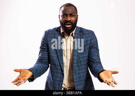 Portrait of businessman who is shocked and surprised. Black man in business suit acting surprised. Stock Photo