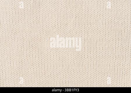 Background made of white knitted fabric. Front surface. Stock Photo